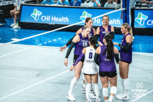 Addison Massey (15) hypes up the crowd and team after a point in an away game against the Creighton Bluejays on September 18, 2026 in Omaha, Nebraska. Photo by Rob Olvera.