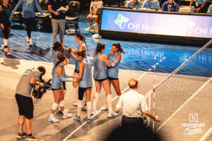 Ayden Ames (9) celebrates with Abbey Hayes (2) after winning the first set in a home game against the Kansas State Wildcats on September 18, 2026 in Omaha, Nebraska. Photo by Rob Olvera..