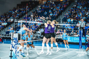 Addison Massey (15) blocks a hit from the Bluejays in an away game against the Creighton Bluejays on September 18, 2026 in Omaha, Nebraska. Photo by Rob Olvera.