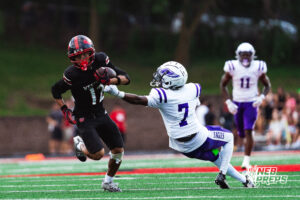 Westside's #12 wide receiver Yasir Grixby jukes a Central defender, during a High School Football game, Friday, September 18th, 2026, in Omaha, Nebraska. Photo by Nick Barajas.
