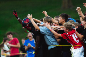 Westside's running back #6 Tay Tay Jenkins embraced by fans after scoring a touchdown, during a High School Football game, Friday, September 18th, 2026, in Omaha, Nebraska. Photo by Nick Barajas.