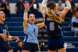 Concordia’s Claire Monjarez (4) yells and throws her hands up in celebration after the Mustangs scored a point during a high school volleyball game against Elmwood-Murdock on Thursday, September 17, 2026 in Omaha, Nebraska. Photo By Jack Stephens.