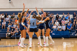 The Concordia Mustangs celebrate as a team after libero Claire Monjarez (4) scored a point during a high school volleyball game against Elmwood-Murdock on Thursday, September 17, 2026 in Omaha, Nebraska. Photo By Jack Stephens.