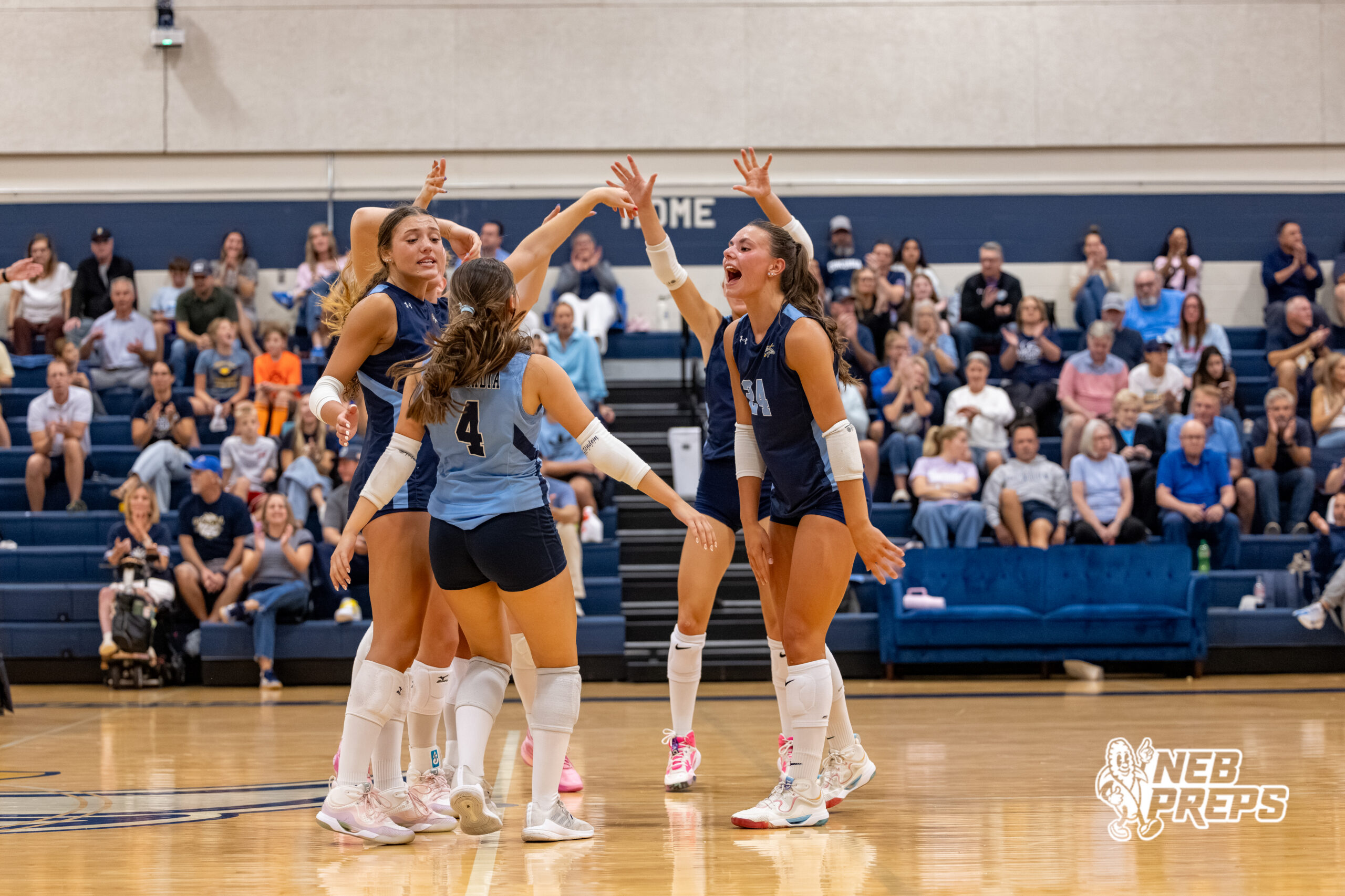 The Concordia Mustangs celebrate as a team after libero Claire Monjarez (4) scored a point during a high school volleyball game against Elmwood-Murdock on Thursday, September 17, 2026 in Omaha, Nebraska. Photo By Jack Stephens.