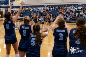The Concordia Mustangs and their bench celebrate after scoring a point during a high school volleyball game against Elmwood-Murdock on Thursday, September 17, 2026 in Omaha, Nebraska. Photo By Jack Stephens.