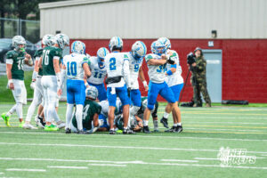 Austin Ruhter (34) celebrates the first tackle during a football game against the Lincoln Southwest Silverhawks on September 25, 2026, in Lincoln, Nebraska. Photo by Rob Olvera.