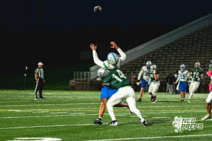 Jase Coke (14) gets a huge hit on Tory Pittman (3) during a football game against the Millard North Mustangs on September 25, 2026, in Lincoln, Nebraska. Photo by Rob Olvera.