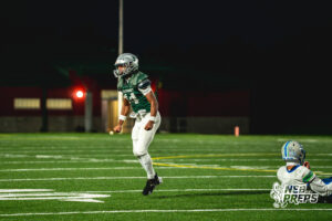 Jase Coke (14) celebrates a huge hit on Tory Pittman (3) during a football game against the Millard North Mustangs on September 25, 2026, in Lincoln, Nebraska. Photo by Rob Olvera.