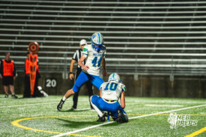 Luke Jacobsen (44) kicks a PAT held by Ethan Cutler (10) during a football game against the Lincoln Southwest Silverhawks on September 25, 2026, in Lincoln, Nebraska. Photo by Rob Olvera.