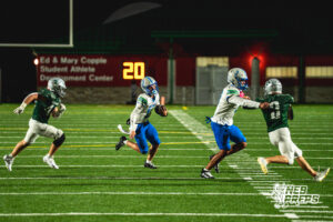 Logan Grosdidier (13) follows his lead blocker Tory Pittman (3) during a football game against the Lincoln Southwest Silverhawks on September 25, 2026, in Lincoln, Nebraska. Photo by Rob Olvera.