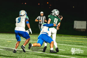 Royce Anderson (29) Evan Robinson (9) tackle Quarterback Thatcher Shelton (9)during a football game against the Lincoln Southwest Silverhawks on September 25, 2026, in Lincoln, Nebraska. Photo by Rob Olvera.