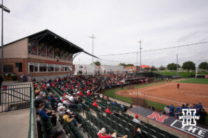 A general view of Bowlin Stadium as Kansas players gather outside their dugout in a college softball game.