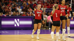 Laney Choboy (6) and her teammates celebrate after a point against Northwestern. Photo courtesy Nebraska Athletics.