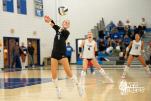 Katelyn Dyrstad passes the ball in a high school volleyball match.