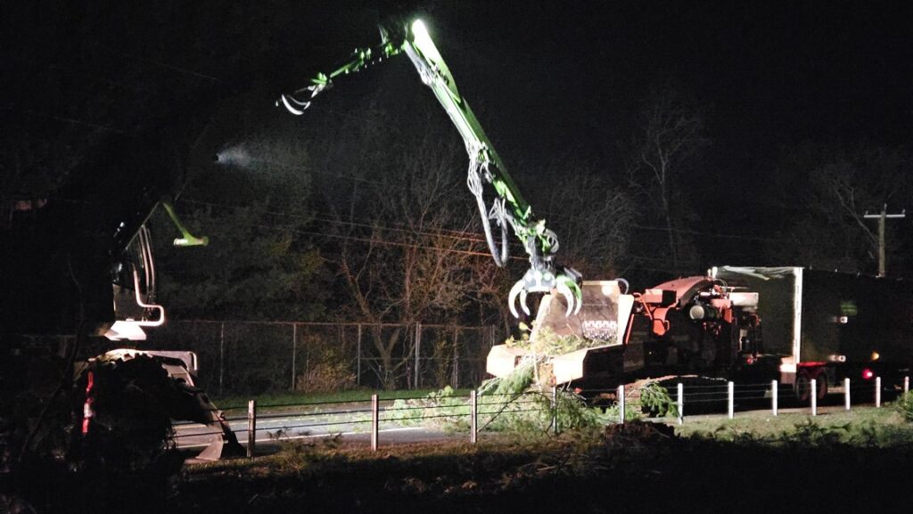 Photo of night time tree clearing operations in the Phase 3 project limits