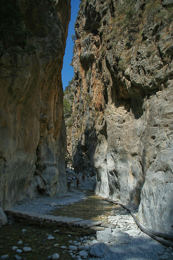 Samaria gorge The chasm on this picture is located in the Samaria gorge, on the island of Crete, Greece. It is said to be the largest and narrowest gorge in Europe, where the smallest point only measures 4 meters wide, with towering walls on each side spanning 500 meters Chasm,Crete,Europe,Geotagged,Gorge,Greece,Samaria Gorge