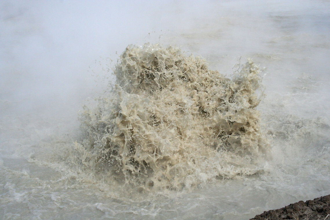 Geothermal water explosion This water explosion was photographed at a geothermal lake where super heated water exploded onto the surface in Yellowstone National Park Explosion,Geothermal,Lake,National park,North America,United States,Yellowstone National Park