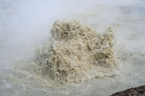 Geothermal water explosion This water explosion was photographed at a geothermal lake where super heated water exploded onto the surface in Yellowstone National Park Explosion,Geothermal,Lake,National park,North America,United States,Yellowstone National Park