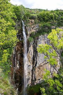 Skaklia Waterfall The Skaklia waterfall is located in the Iskar Gorge near the Bov railway station in Stara planina mountain, North-West Bulgaria. This is one of the highest and most beautiful waterfalls in Bulgaria.
The Skaklia waterfall consists of two levels: the upper one drops about 90 meters, and the lower one about 20 meters. The Skaklia waterfall can be approached from the upper side, following the eco-trail starting from the village Zasele. The eco-trail is winding down through rocks and forests and leads to the bottom of the waterfall. 
The waterfall can be reached as well from the other (lower) end of the eco-trail, from Bov railway station. Bulgaria,Geotagged,landscape,nature,waterfall