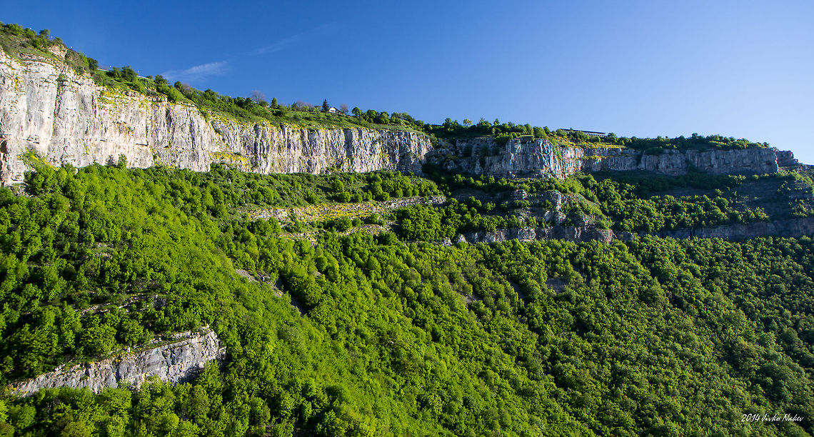 Stara Planina Mountain View from Zasele village above the Skaklia waterfall. The Skaklia waterfall is located in the Iskar Gorge near the Bov railway station in Stara planina mountain, North-West Bulgaria. This is one of the highest and most beautiful waterfalls in Bulgaria.<br />
The Skaklia waterfall consists of two levels: the upper one drops about 90 meters, and the lower one about 20 meters. The Skaklia waterfall can be approached from the upper side, following the eco-trail starting from the village Zasele. The eco-trail is winding down through rocks and forests and leads to the bottom of the waterfall. <br />
The waterfall can be reached as well from the other (lower) end of the eco-trail, from Bov railway station. Bulgaria,Geotagged,Stara planina,landscape,mountain,nature,waterfall