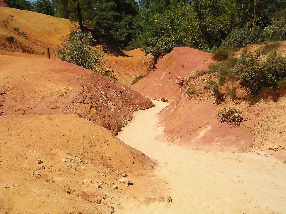 Ochre near the French town of Roussillon This picture shows the ochre colored ground near the French town of Roussillon.<br />
Since the 18th century this ochre is used as dye for paintings and clothes. Today mining is forbidden to prevent all the ochre from being mined. France,Geotagged