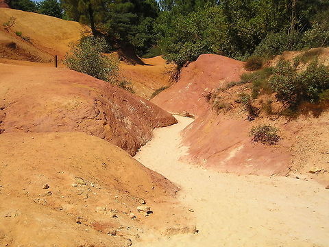 Ochre near the French town of Roussillon This picture shows the ochre colored ground near the French town of Roussillon.
Since the 18th century this ochre is used as dye for paintings and clothes. Today mining is forbidden to prevent all the ochre from being mined. France,Geotagged