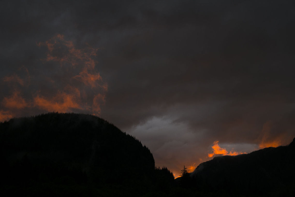 Sunset in the mountains Sunset catches the clouds clinging to the tops of the mountains. Snoqualmie Pass, Washington. Sunset,mountains