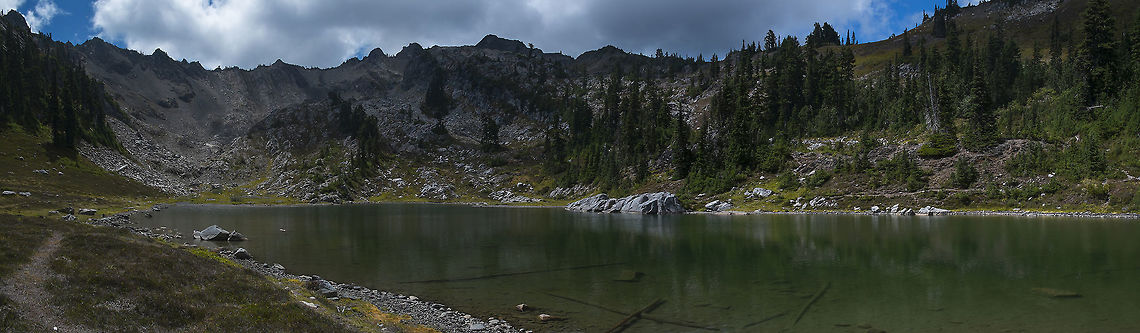 Lake of the Angels Though this lovely alpine lake isn't terribly far from a road, it's still relatively lightly visited. It's a difficult 4 mile hike to reach the cirque, on a very steep and often loose and gravelly trail. Then there is the headwall... while it's technically a scramble (so it can be done without ropes or other specialized equipment) I did leave my pack below the last headwall section, as I did not think I would feel comfortable coming down that part, with (for short 5' me) it's limited hand and foot holds and necessity to turn around at one point. The nice part - we had the lake all to our selves and only ran across a few people on the trail the entire day. Geotagged,Summer,United States