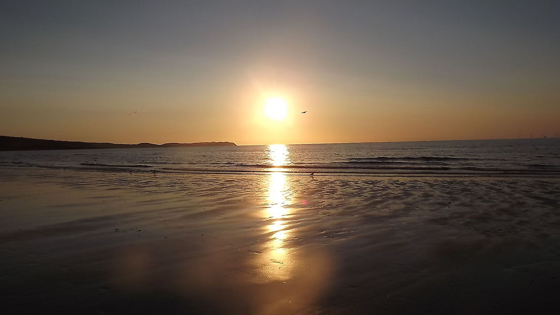REFLECTIONS the sun going down over the Irish Sea, Rhyl,NORTH WALES Geotagged,United Kingdom