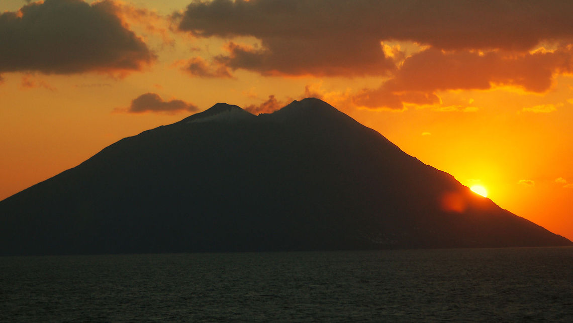 Stromboli Volcano Stromboli is a small island in the Tyrrhenian Sea, off the north coast of Sicily, containing one of the three active volcanoes in Italy. It is one of the eight Aeolian Islands, a volcanic arc north of Sicily. Wikipedia Aeolian Islands,Geotagged,Italy,Stromboli,Volcano,active volcano