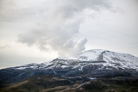 Nevado del Ruiz, Colombia An active volcano at elevation 5,321m. It is notorious for a 1985 event where an eruption led to a mud stream down the flanks of the volcano that would erase the town of Armero (situated a stunning 5,000m lower), leaving 23,000+ death. Especially tragic was that those in the know of it coming, failed to get through to the national and local authorities whom framed it as "scaremongering". Next, as it became absolutely sure that the town would be hit, the town's electricity grid failed, making communication impossible.

https://en.wikipedia.org/wiki/Armero_tragedy
https://www.jungledragon.com/image/149409/nevado_del_ruiz_lahar_pathway_colombia.html Colombia,Colombia 2022,Fall,Geotagged,South America,Termales del Ruiz,World