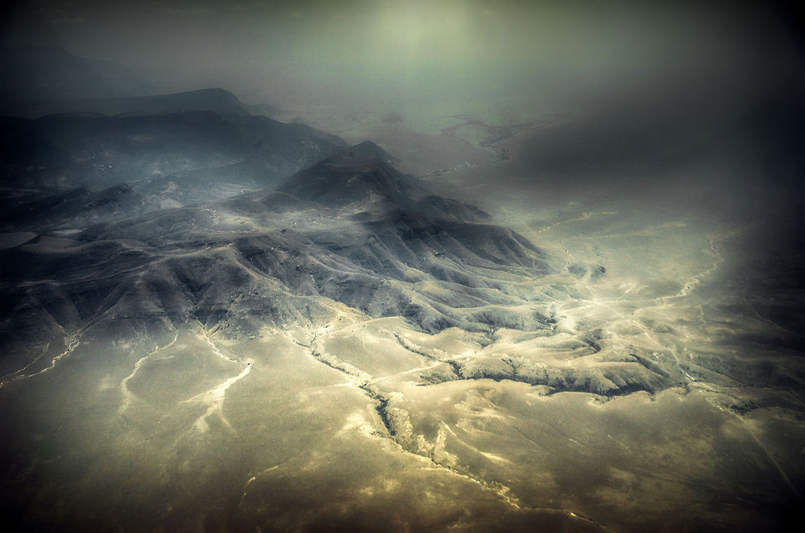 Tanzania mountain ranges from the air - 1 A series of photos of Tanzania from the air. The originals were so soft due to light pollution and the airplane window that I had to go a little overboard in post processing. Africa,Serengeti North,Serengeti area,Tanzania