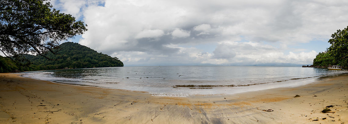 Nosy Mangabe, a tropical island to ourselves From Maroantsetra, it is a 30 minute boat fair to this island, Nosy Mangabe (not to be confused with Nosy Be). It has no permanent settlement, only tourists visiting every now and then. When we arrived, the only tourists on the island were leaving, which means it was just us, a park ranger, a guide and a cook. <br />
<br />
We spent one day and night here, and did 3 walks, basically all day long. The island is known for two lemurs, the white-belted black-and-white ruffed lemur and the white-fronted brown lemur. It has very few birds, yet all the more frogs and reptiles. <br />
<br />
This photo was taken from the beach after arriving. Africa,Geotagged,Madagascar,Madagascar North,Nosy Mangabe,Spring,World