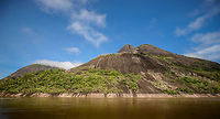 Cerros de Mavecure - ground level, Inírida, Colombia Ground level shot of Cerros de Mavecure, a geological site in Colombia only accessible by boat, consisting of 3 mountains rising up from the Amazon. This is a stitched panorama to fit in both Mono (Monkey, 480m) and Pajarito (Little Bird, 712m). Colombia,Guainía,Inírida,South America,World