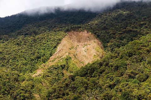 Giant Landslide, Trampoline of Death, Colombia Here's the aftermath of a large natural landslide found in Southern Colombia as seen from the Trampoline of Death road between Mocoa and La Cocha. This region is plagued by landslides that are typically caused by the steepness of the terrain combined with heavy rainfall. 

This region of the Andes has some of the largest drops, consider an altitude change from 500m to 5,500m in a mere 50-100km of distance. Such drops are only found in the Himalayas and here.

In 2017, a large landslide wrecked the town of Mocoa, leaving hundreds dead. Deforestation can also be a cause of landslides, but in this instance it doesn't look to be a factor.

Some more natural events here, if you're interested:

https://www.jungledragon.com/tag/17197/natural_events.html Colombia,Colombia 2018,Colombia South,Natural events,South America,Trampoline of Death,World