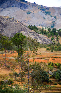 Ambositra landscapes 2 The scarred beauty of the Ambositra area, a mixture of mountain ranges, the typical red soil of Madagascar, agriculture and some small pockets of green. Ambositra,Geotagged,Madagascar