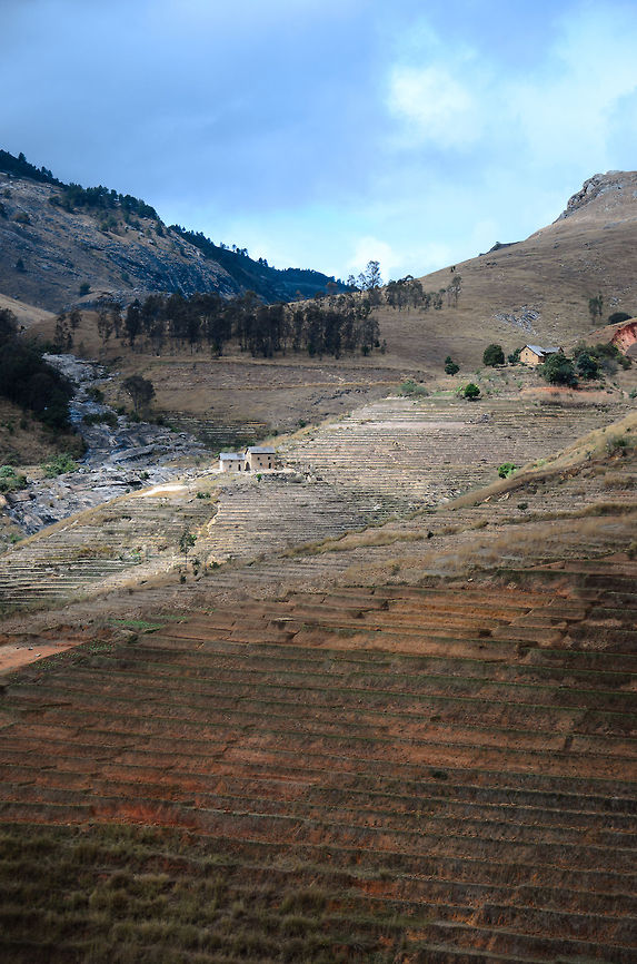 Typical ihosy landscape This landscape sums up most of the Madagascar landscapes: mountain ranges, stripped of vegetation, heavy agriculture, small pockets of human settlement, and even smaller pockets of green. Geotagged,Ihosy,Madagascar