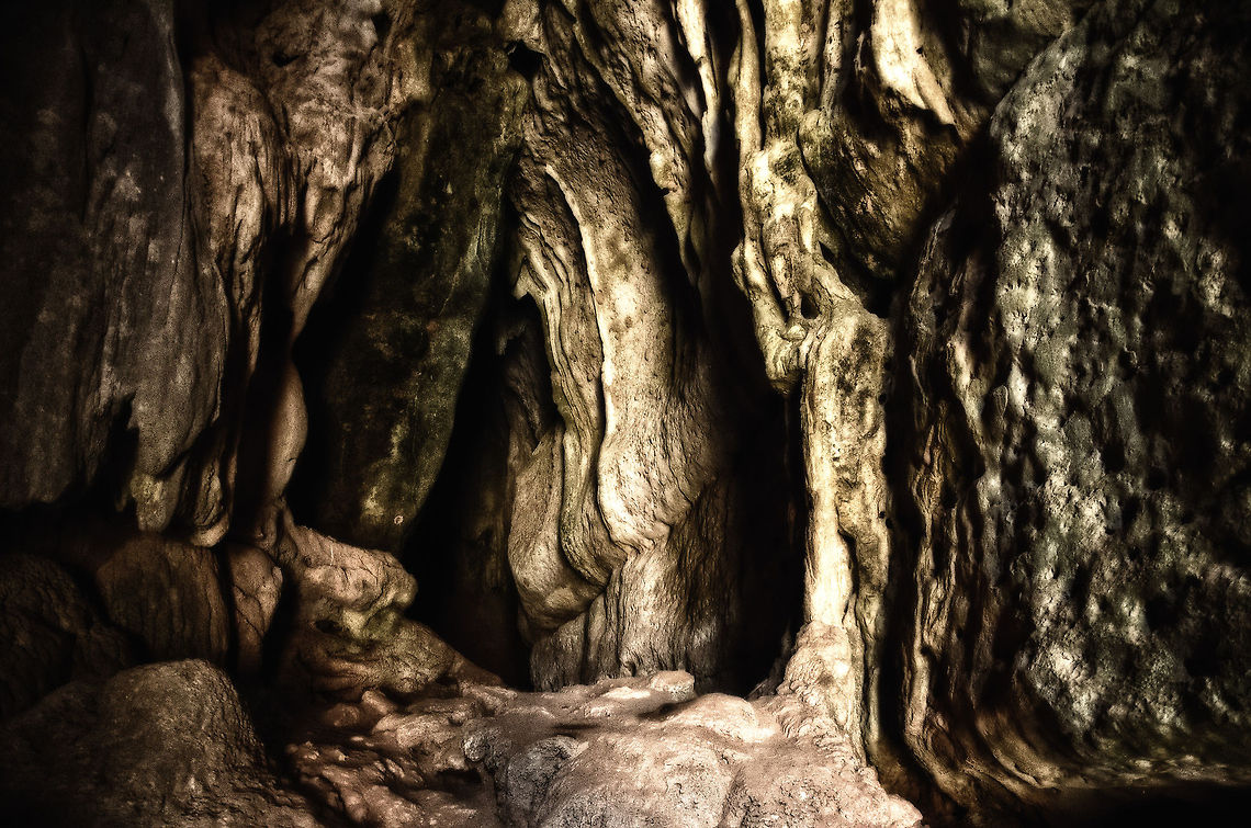 Cave spectacle in Tsingy, Madagascar The entrance of a water-bordered cave. It feels really special to enter these caves. Tsingy in itself is already very remote (10 hour bumpy drive), next entering prehistoric caves that can only be accessed by water feels extra adventurous and mystical. Madagascar,Tsingy de Bemaraha National Park