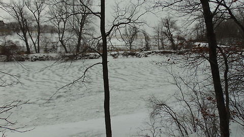 frozen over river froven over covered in snow