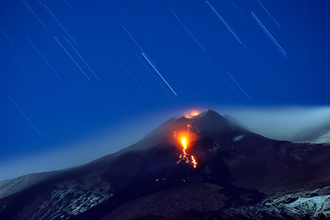 Startrails on Mount Etna Eruption of 6th February 2013. A triple-vent eruption from New South East Crater (NSEC) shot using a long exposure time (3&#039;). Geotagged,Italy,Natural events,crater,eruption,etna,flow,lava,mount,nsec,vent