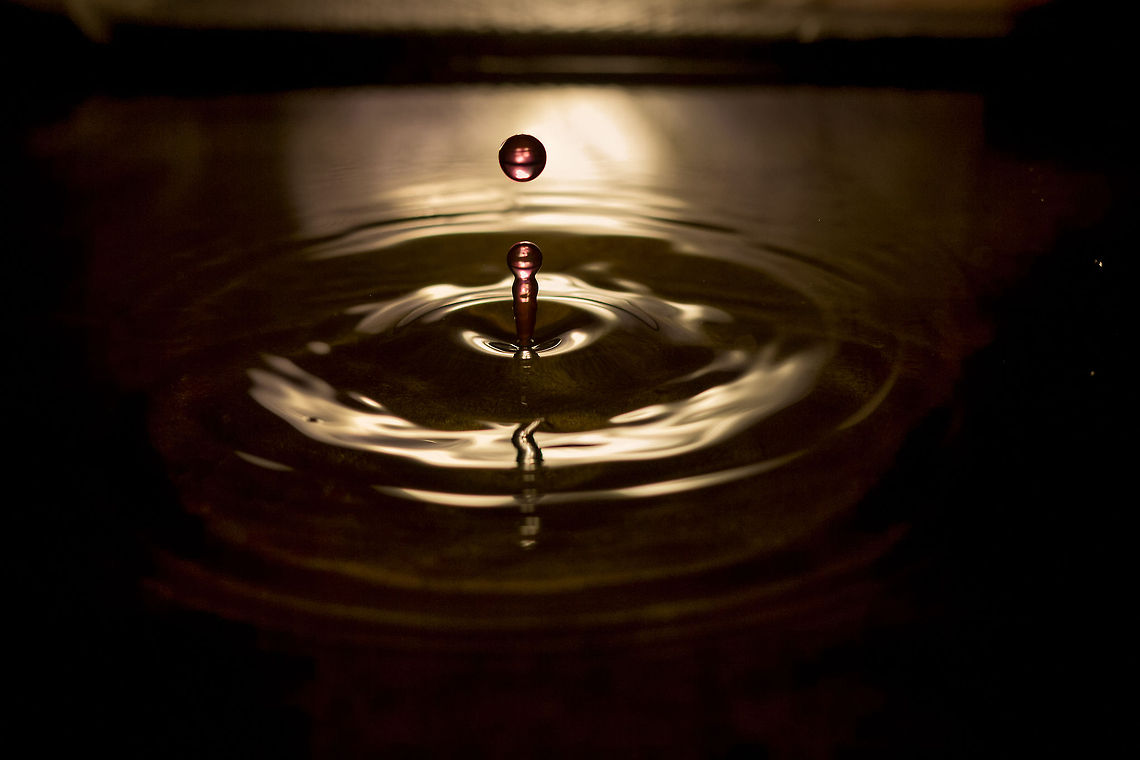 Darkness, a sudden sound A drop of reddish liquid, seperated, falling, keeping form regardless of the coming adventure. Lemonade meets tapwater. Assimilation imminent, resistance futile. A moment frozen in time.  Geotagged,The Netherlands,drop,droplet,water