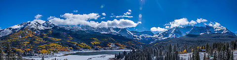 The Colorado Rocky Mountains beginnings to another winter season. This image was stitched together using 5 individual portrait landscape shots. The lake is beginning to freeze as the fall colors still paint the landscape. colorado,fall colors,lake,rocky mountains