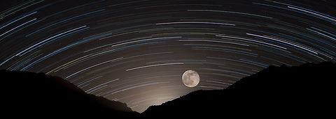 Time Compression Hopefully this type of shot is allowed on this site. This image was several star trail and moon shots taken over the Catalina Mountain Tucson, Arizona, USA. The glow behind the mountain is the moon before becoming visible above the ridge line. full moon,mountains,sky,star,star trails,stars
