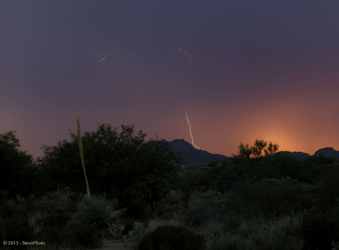 Handheld at Sunset This image was captured during sunset in the Arizona desert. I literally snapped as I anticipated the strikes. This one shows a lot of dispersion in the atmosphere above the actual ground impact which is not normally seen. Natural events,arizona,desert storms,lightning strike