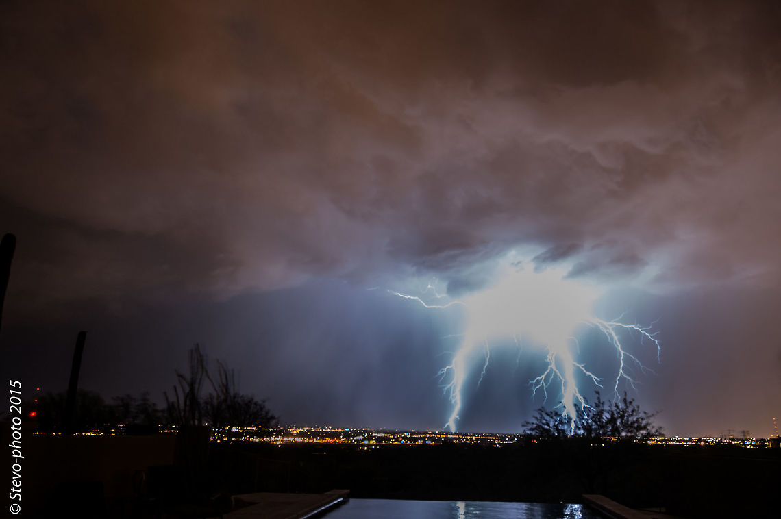 Big Bang! This was an amazing capture. You can see city lights under the impact zone which I estimate to be 3-4km wide from end point to end point of the illumination from the strike. I wasn't even sure what it was going to look like from the camera's lcd since it was taken in 2011 on a D70 and the screen just looked like a bright blob completely blown out. Once on the computer the real story revealed itself. Geotagged,Natural events,United States,arizona,lightning,monsoon,storm,tucson
