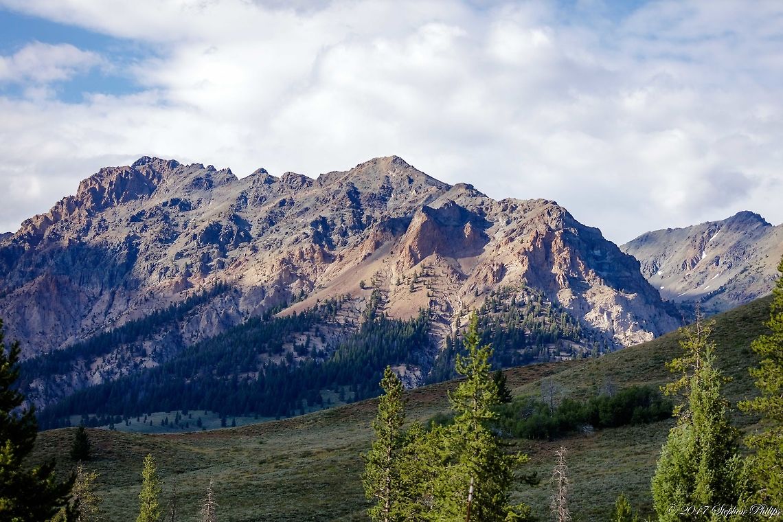 Sawtooth The mountains of Sawtooth National Forest have a varied geological history. The northern Sawtooth Mountains formed from the Eocene Sawtooth batholith, while south of Alturas Lake the Sawtooth, Smoky, and Soldier mountains formed from the Cretaceous granodiorite of the Idaho Batholith. Foothills of the Smoky Mountains are from the Pennsylvanian and Permian Dollarhide formations. The White Cloud Mountains are underlain by the gray granodiorite of the Idaho batholith, while some of the exposed rock is baked impure limestone from the Permian Grand Prize Formation. Geotagged,Summer,United States