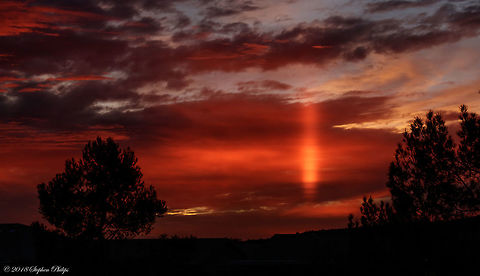 Beaming light Sunsets in the deserts of Arizona can be some of the most amazing in the world. This sunset had the sun beaming through an opening above the horizon in such a way that created a very narrow beam that lasted only a few minutes. I was very fortunate to have been able to capture it in this way. Fall,Geotagged,United States