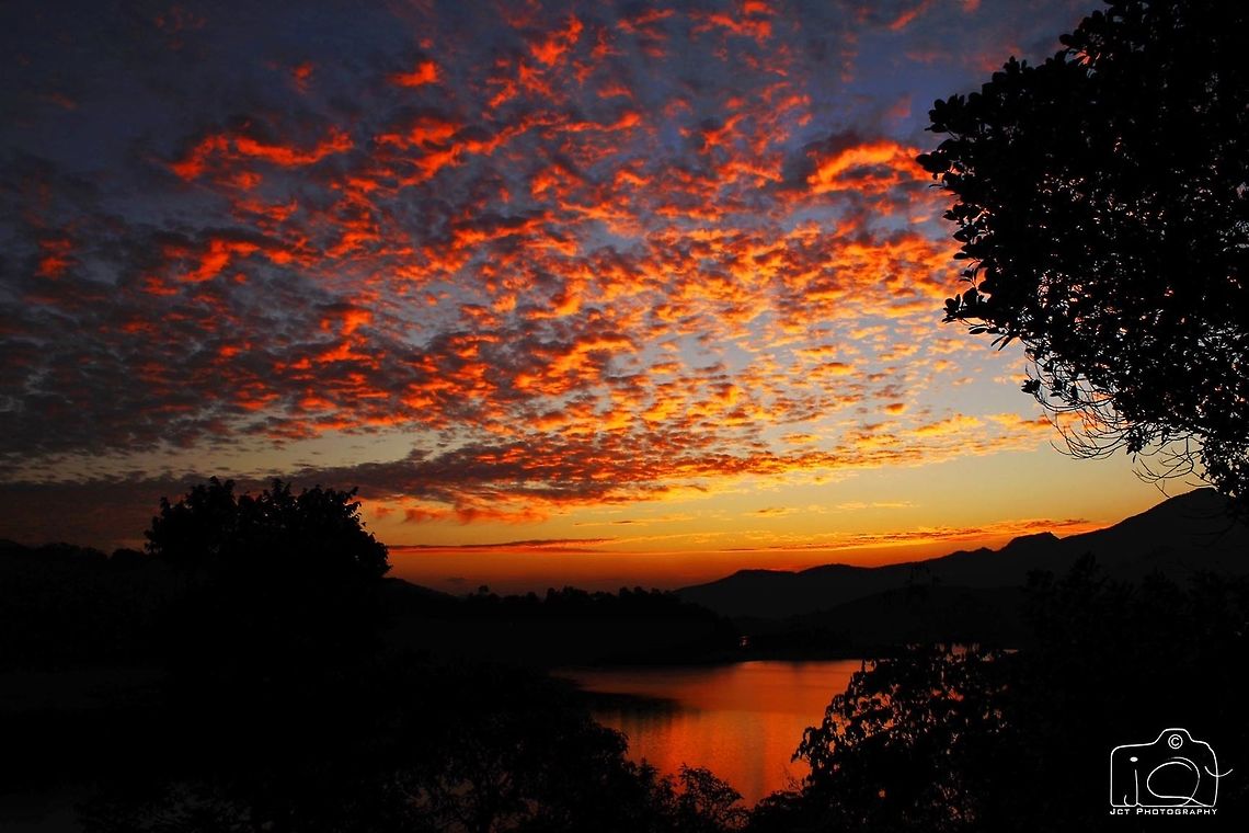 The evening sky A rare view Geotagged,India,Kerala,Silverwoods resort,Winter,banasura sagar dam,crimson,evening,sky,sunset,wayanad