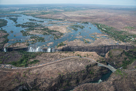 Victoria Falls The border of Zambia and Zimbabwe, photo taken in the dry season. The locals said they had never seen the water level this low in any previous dry season. In the wet season the water flows nearly all the way across. Africa,Geotagged,Spring,Victoria Falls,Zambia,Zimbabwe
