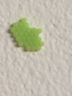 Green Eggs Laid in rows and a lovely colour. Looking for some clues as to identification. They are on a kitchen wall. 
Continued here:
https://www.jungledragon.com/image/61784/green_shieldbug_eggs_part_2.html Geotagged,Green shield bug,Palomena prasina,Summer. Insect eggs. Essex Uk.,United Kingdom